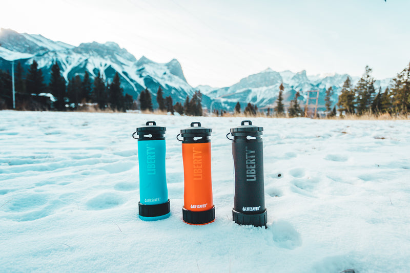 Carica immagine in Galleria Viewer, Liberty water bottles in a snowy mountainside